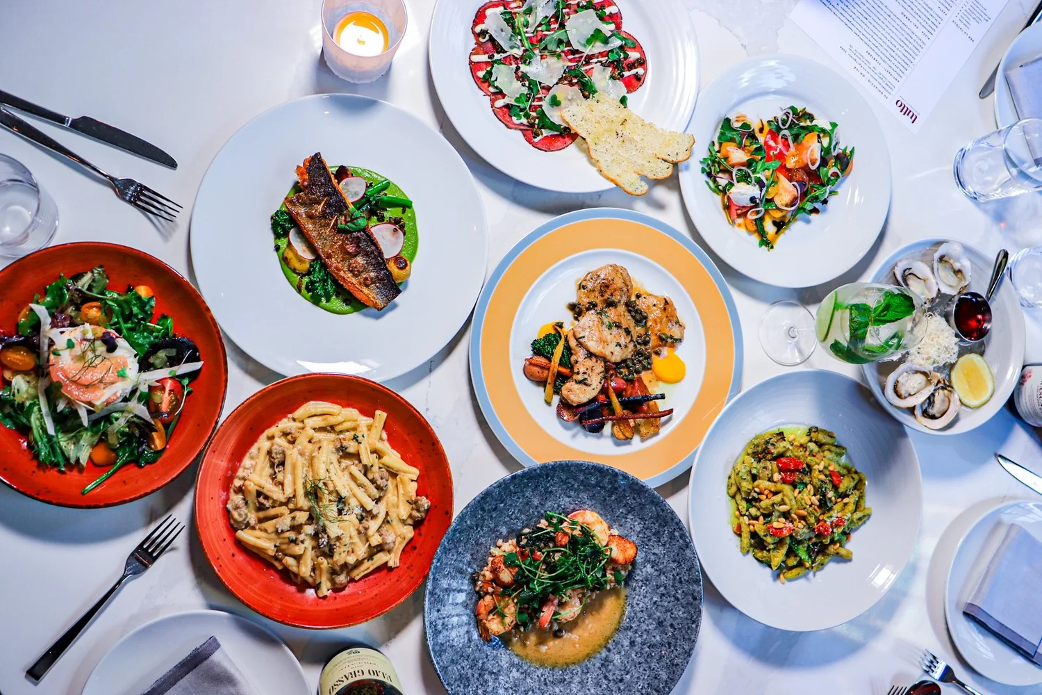 A spread of dishes at Tutto Restaurant & Bar